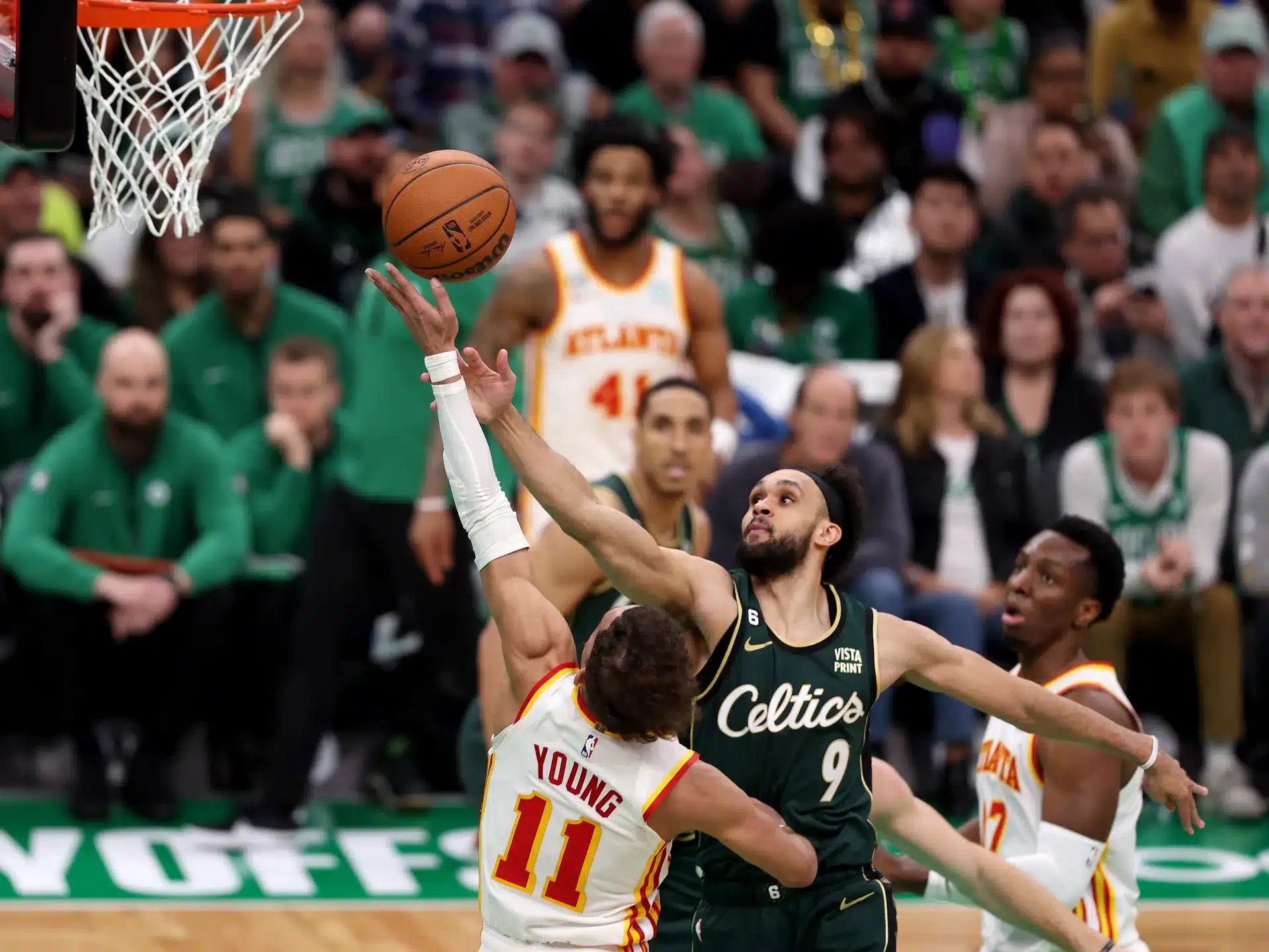 hawks vs celtics live - A man in a green jersey