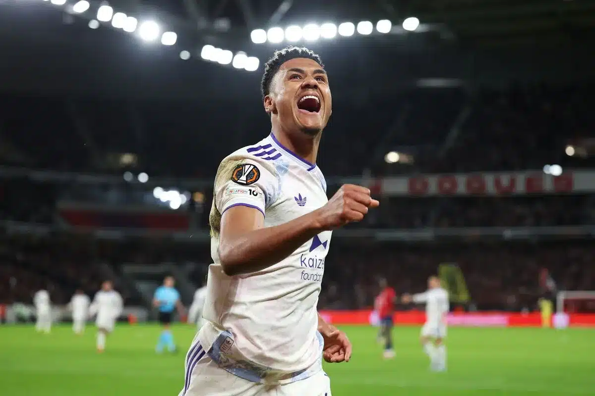 Bologna vs Aston Villa Europa League live - Two men in black jackets and one in red and blue