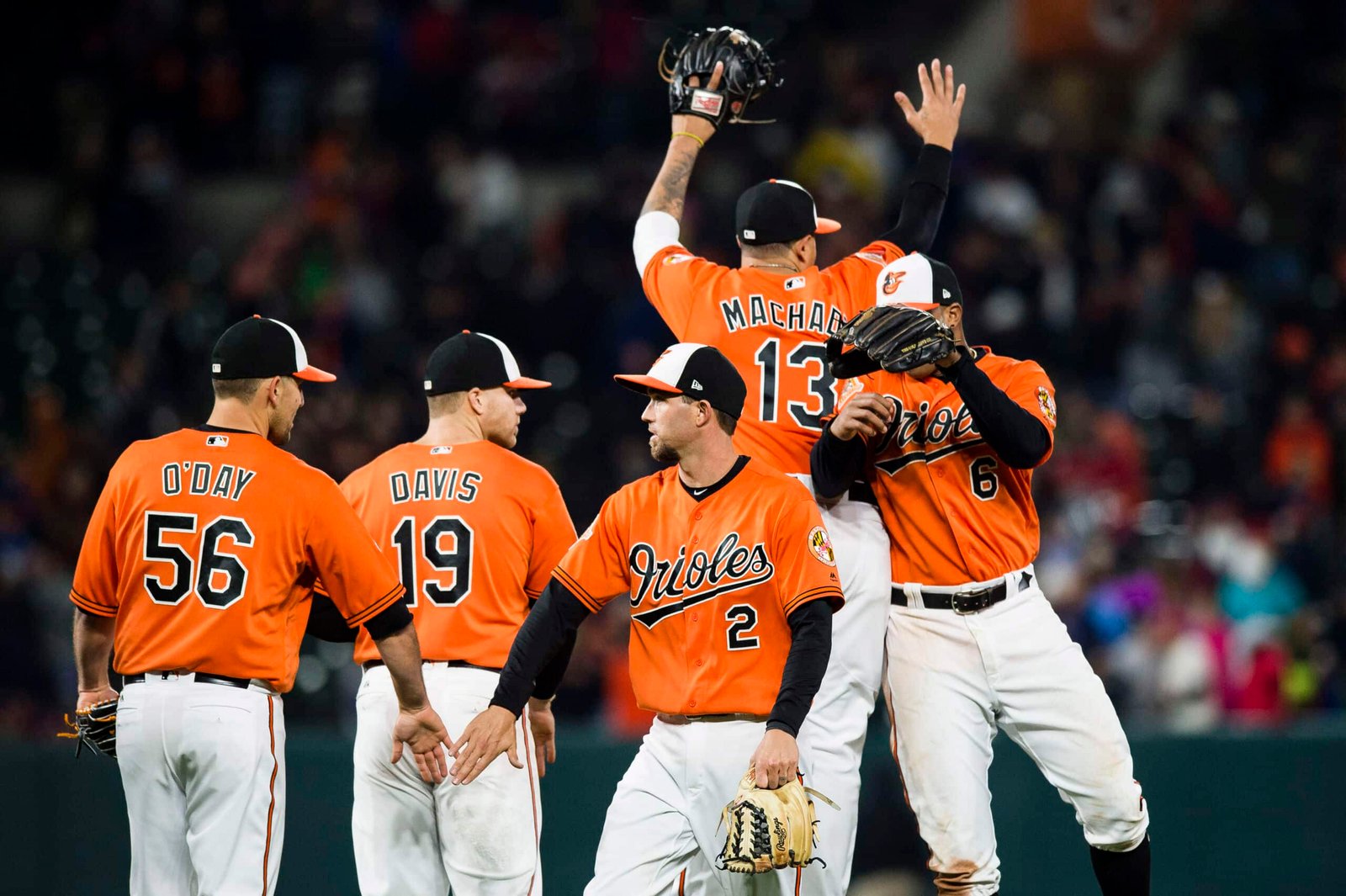 A group of baseball Baltimore Orioles vs Chicago White Sox lives standing on a field