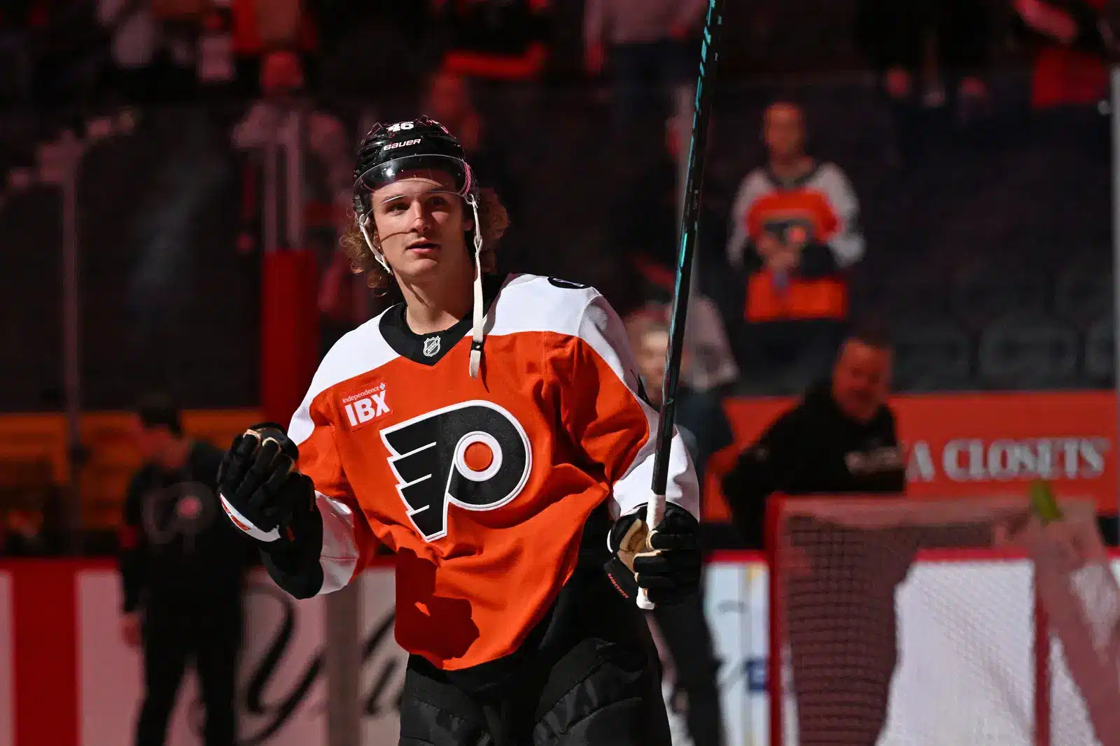 A hockey Anaheim Ducks vs Nashville Predators live stream free in an orange jersey and black gloves