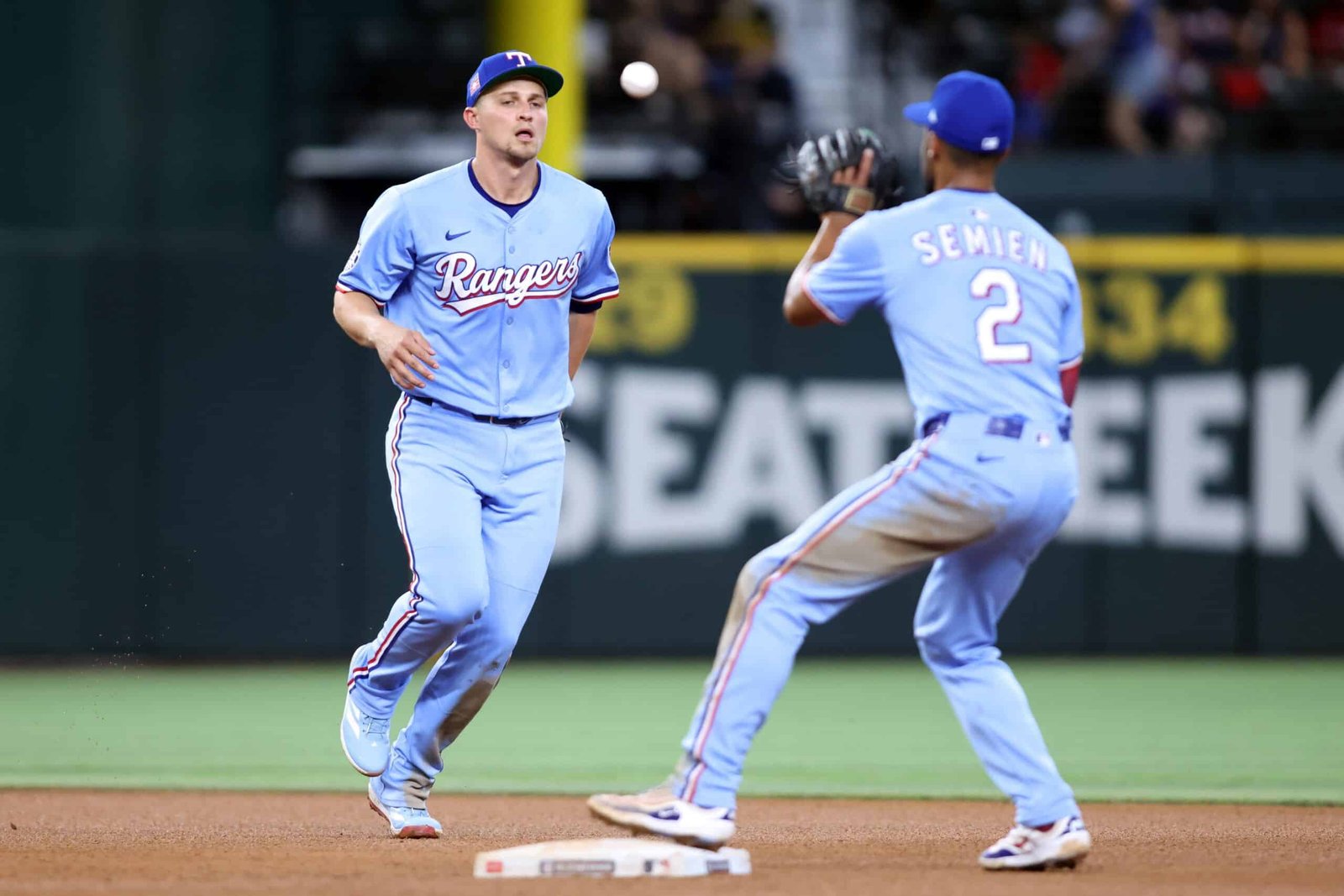 Two baseball Texas Rangers vs Athletics game today times are playing baseball on a field