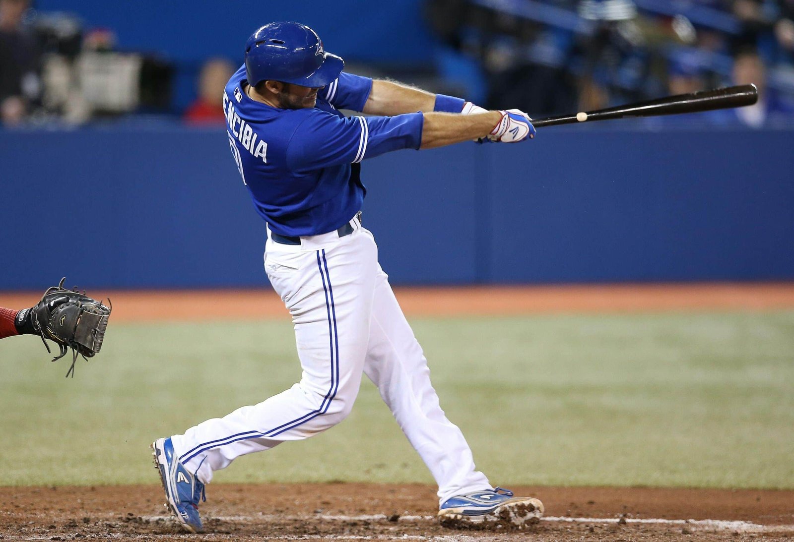 A baseball toronto blue jays vs chicago white sox swinging a bat at a ball